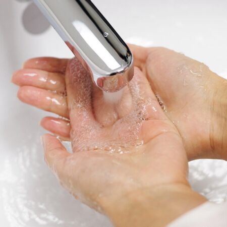 Woman washing her hands with soap 4031825