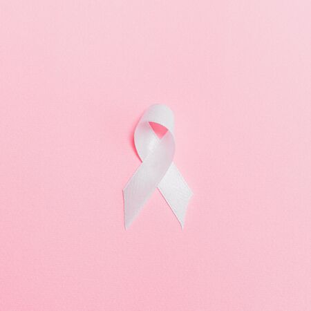 Pink ribbon on pink surface 3900428