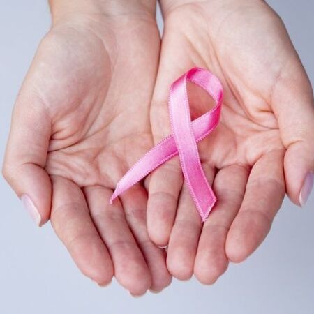 Download Close up Hands Holding Pink Ribbon for free